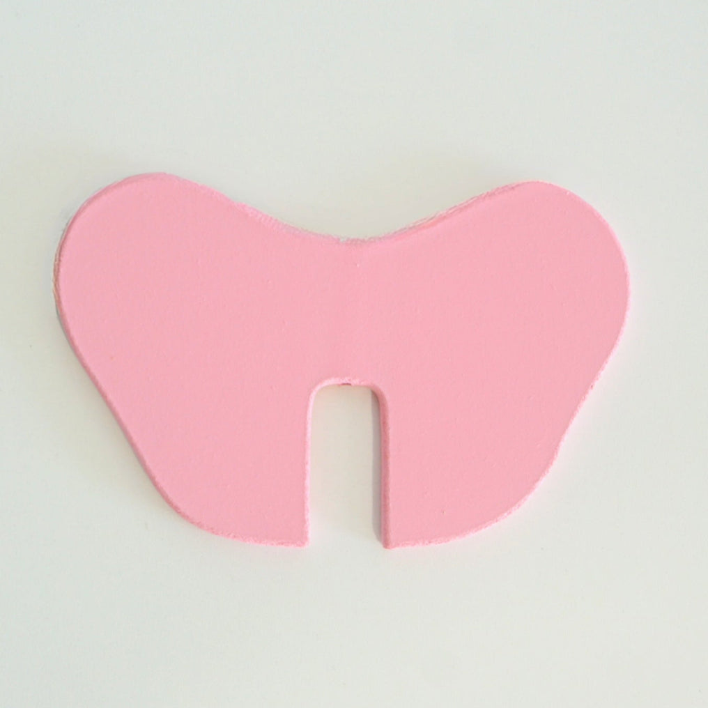 Pink wooden elephant ear replacement part for Big Belly Bank on white background