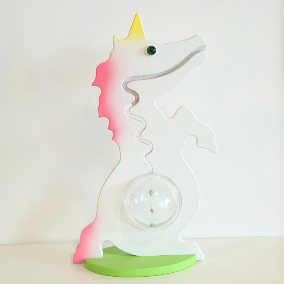 Unicorn-shaped bank with gradient colors on a white background