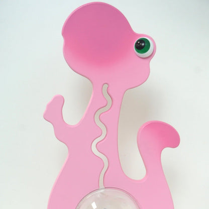 Pink dinosaur bank back view closeup
