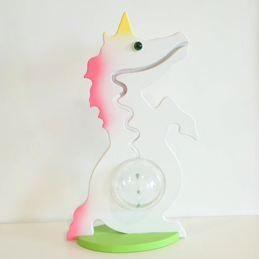 Unicorn-shaped bank with gradient colors on a white background